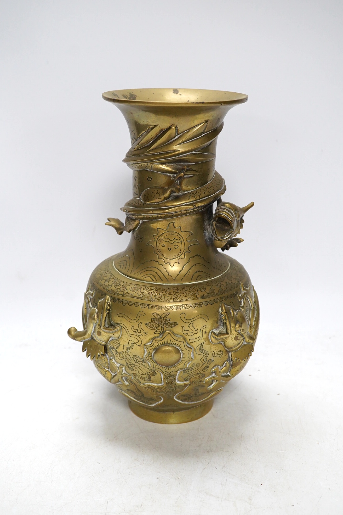 An early 20th century Chinese bronze 'dragon' vase, 25cm. Condition - fair to good